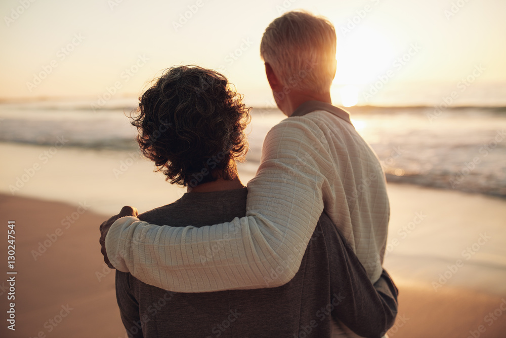 Retired couple watching amazing sunset