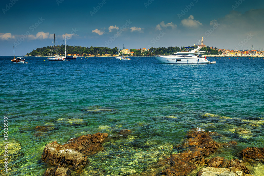 Sunny day with boats and yachts in bay of Rovinj