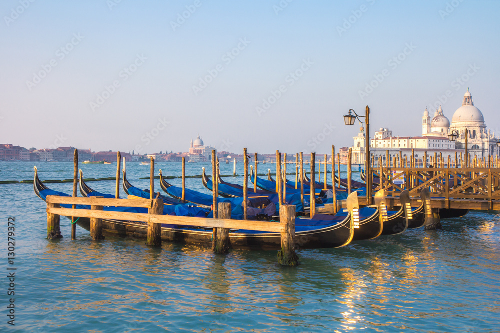 Long exposure of gondolas docked near St Marc square in Venice, Italy.