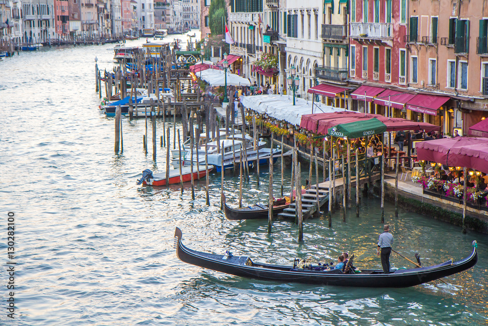 Venetian gondolas on Grand Canal after sunset. Venice, Italy.