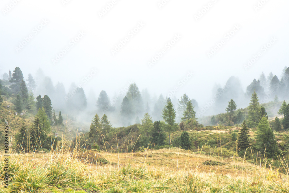 Mountain top in clouds during autumn in Italian Dolomites.