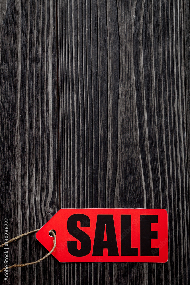 concept of sale on dark wooden background top view