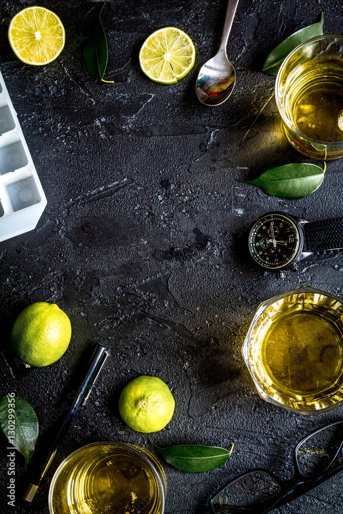 glass of scotch on dark background top view