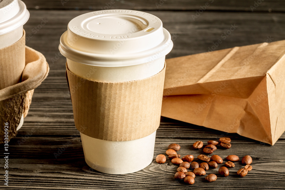 coffee cup to go at wooden background