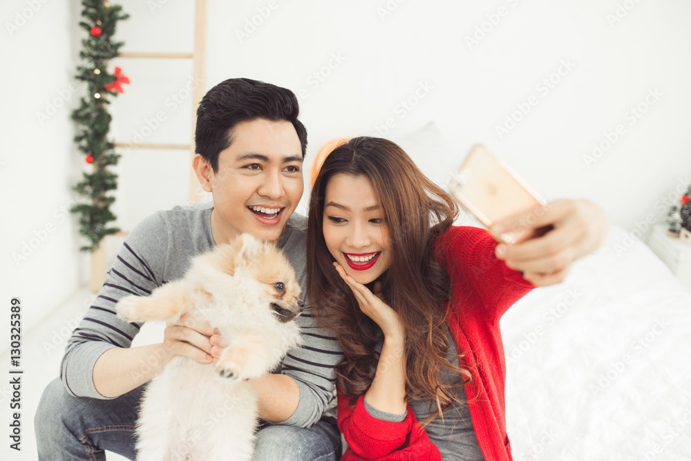 Christmas. Asian Couple Lovers Celebrating New Year at Home.