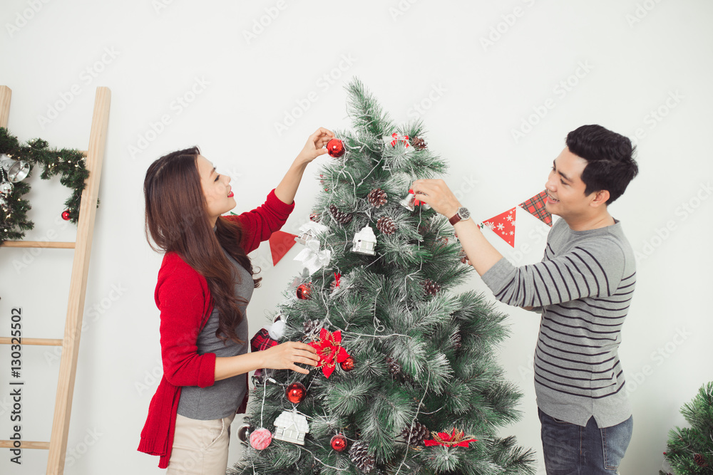 Christmas. Asian Couple Lovers Celebrating New Year at Home.