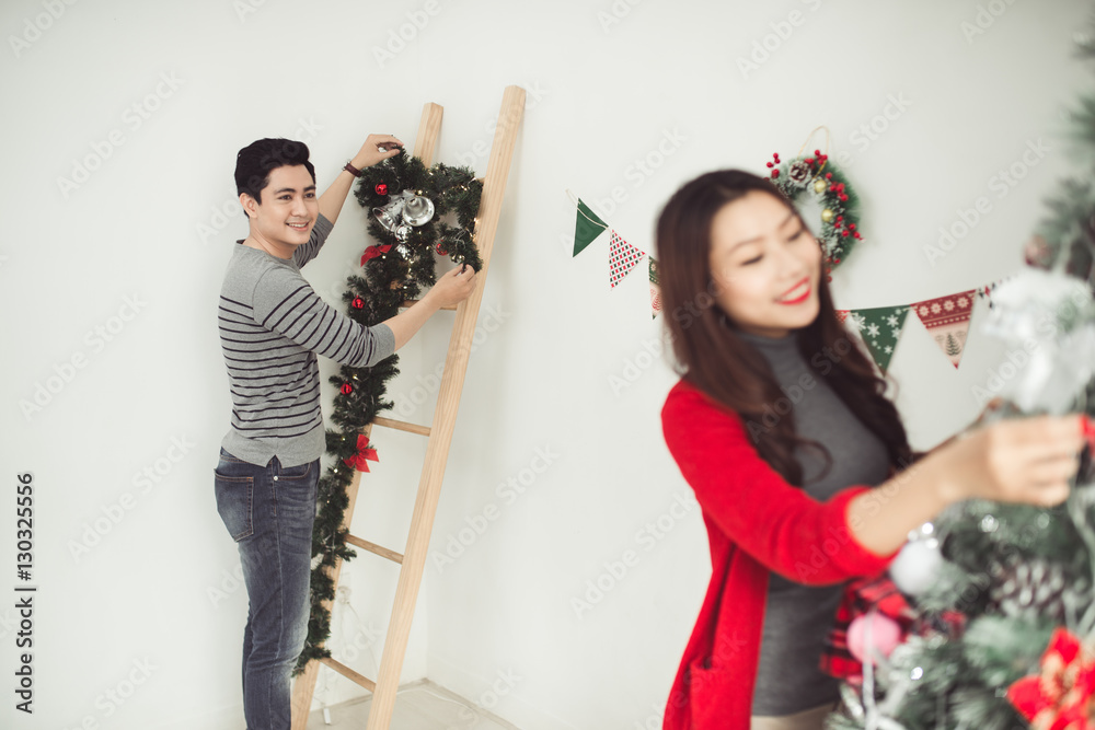 Christmas. Asian Couple Lovers Celebrating New Year at Home.