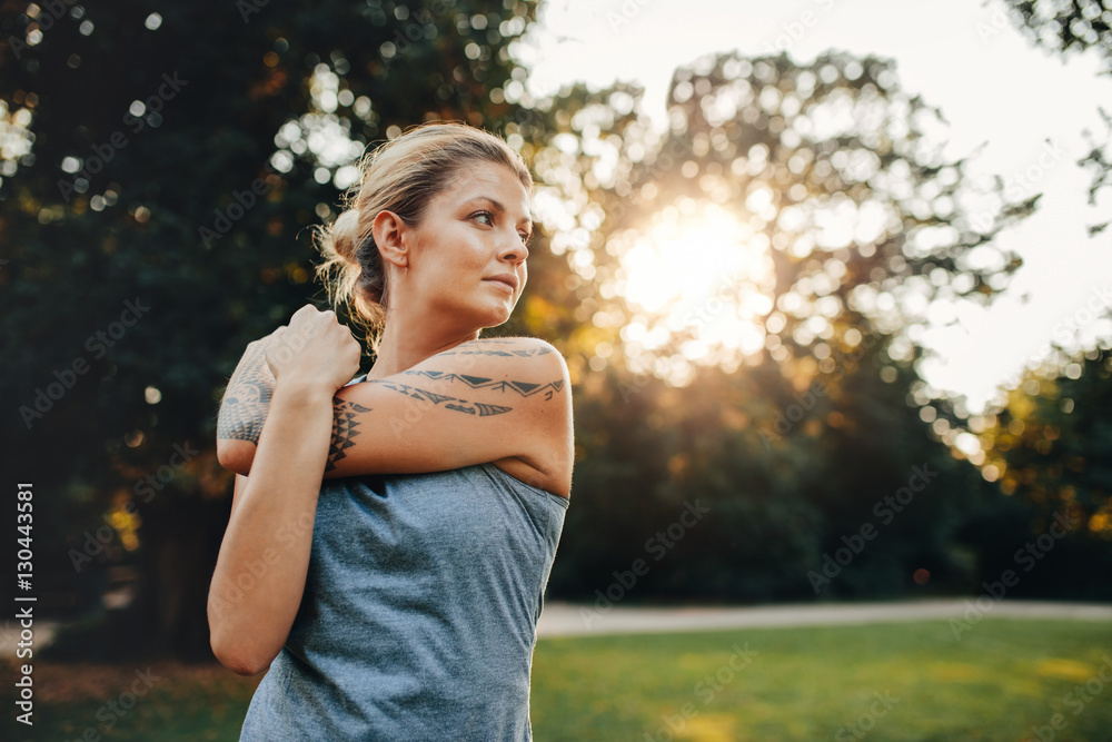 Female exercising at the park in morning