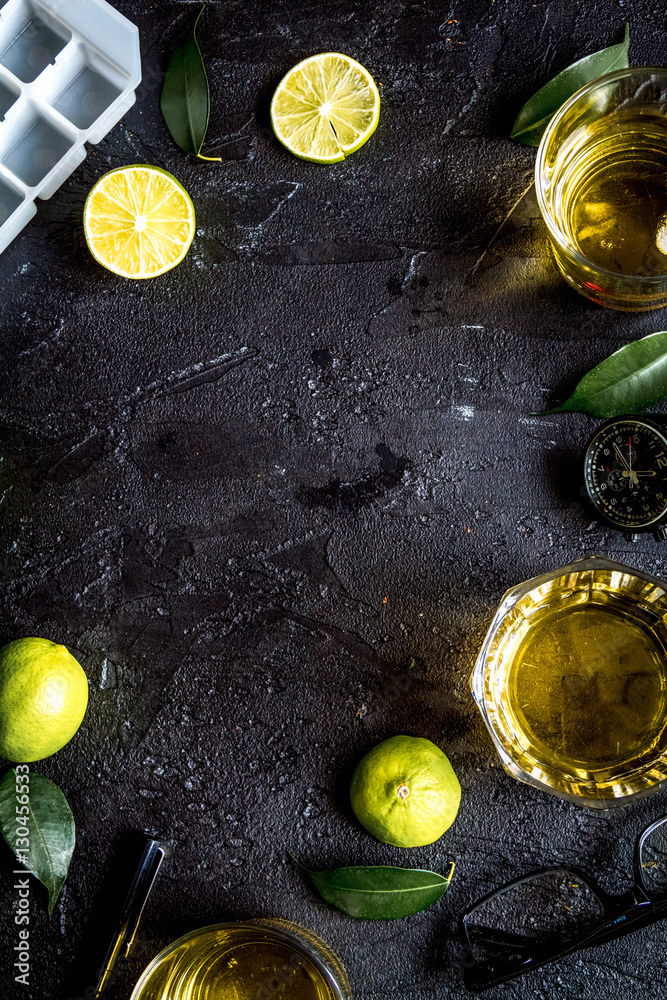 glass of scotch on dark background top view