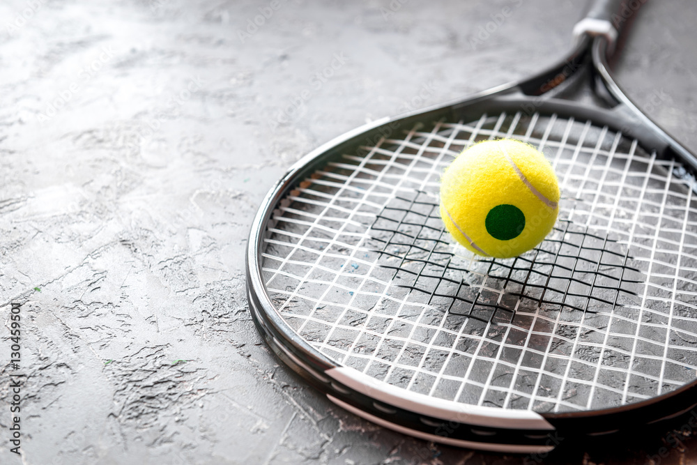 tennis racket on gray background close up