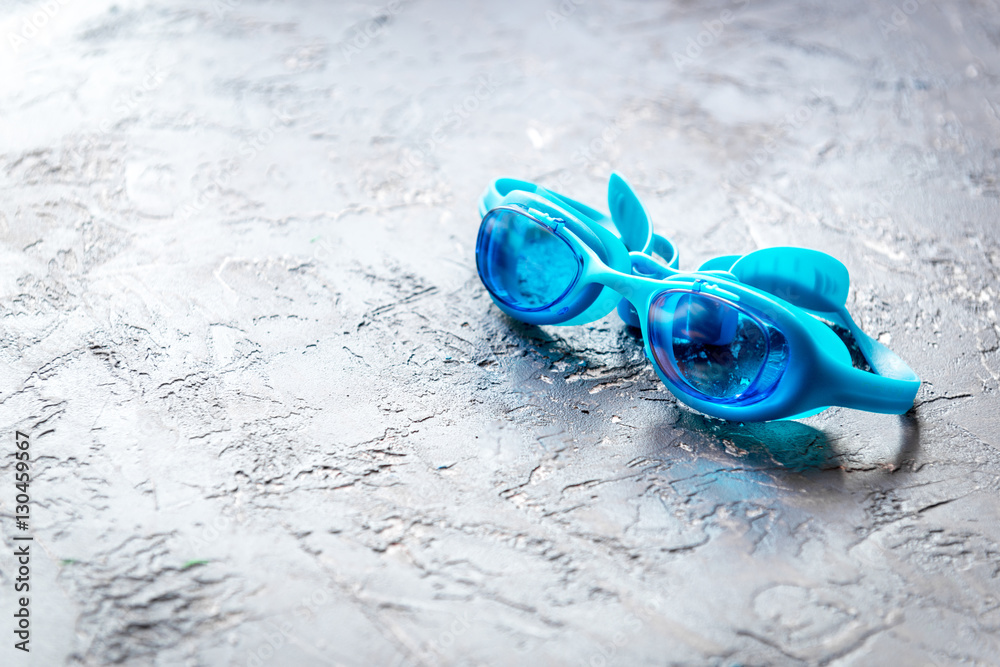 goggles for swimming on gray background close up