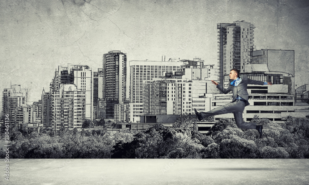 Businessman jumping high