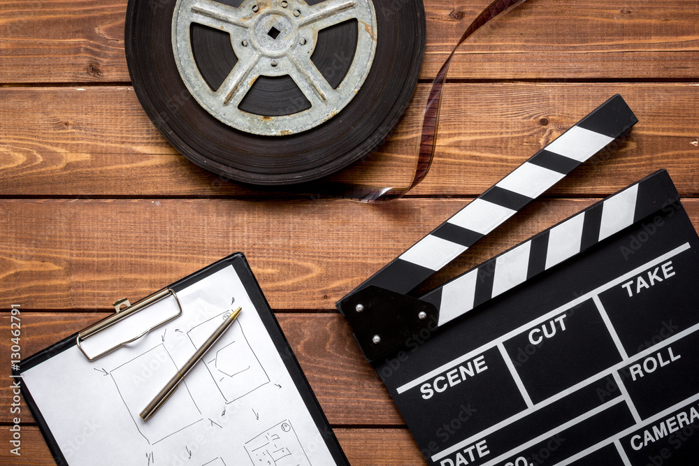 Work screenwriter on wooden background top view