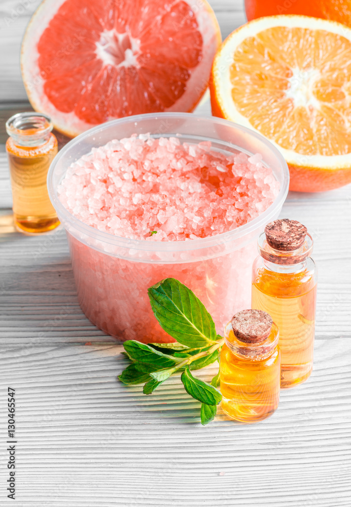 organic cosmetic with citrus on wooden background