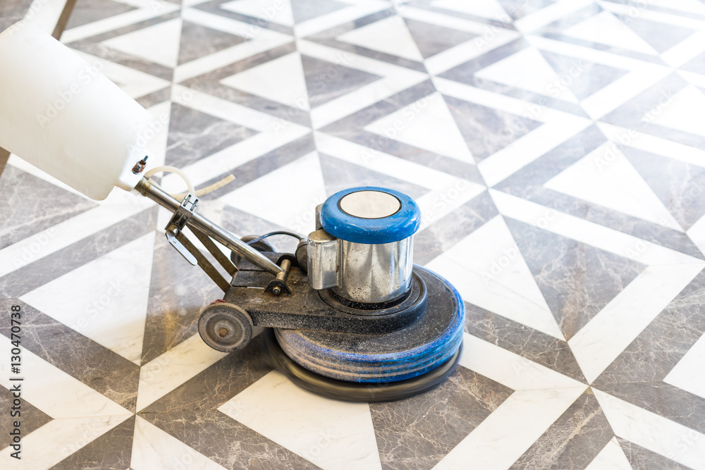 working polisher on marble floor