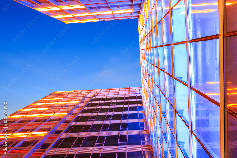 Modern skyscrapers glass wall in the evening