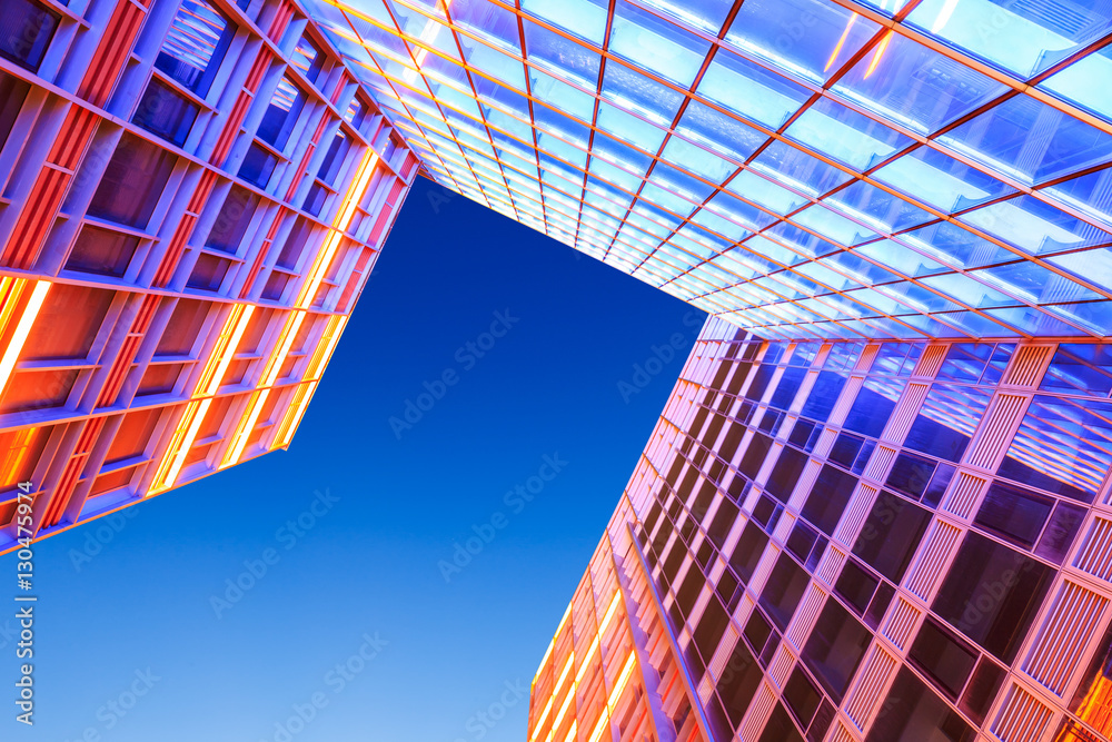 Modern skyscrapers glass wall in the evening