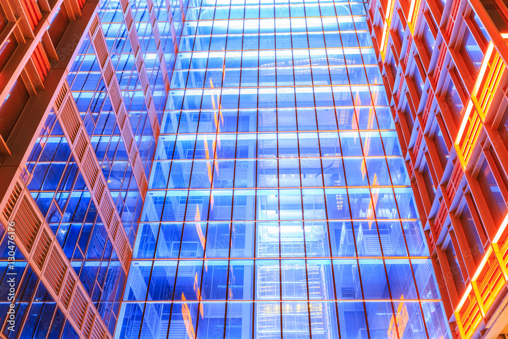 Modern skyscrapers glass wall in the evening