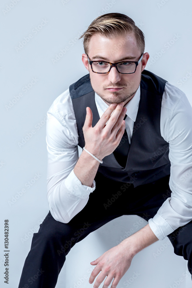 elegant business man with glasses reflects concentrated