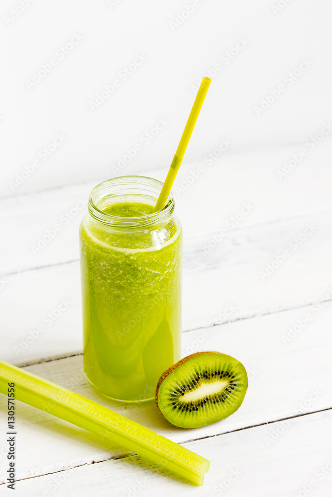 Fresh detox juices in glass bottles on white background