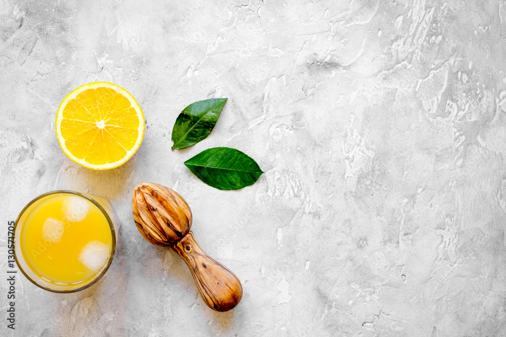 freshly squeezed orange juice on concrete background top view