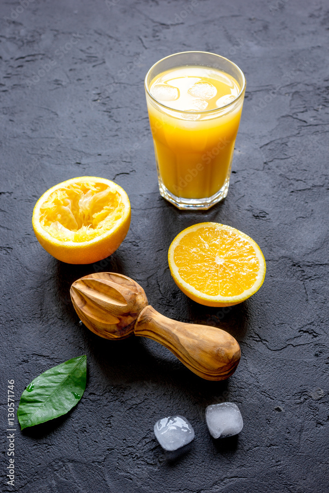 freshly squeezed orange juice on dark background