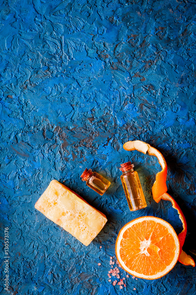 organic cosmetic with citrus on blue background top view