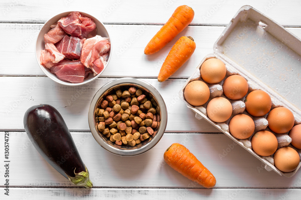 ingredients for pet food holistic top view on wooden background