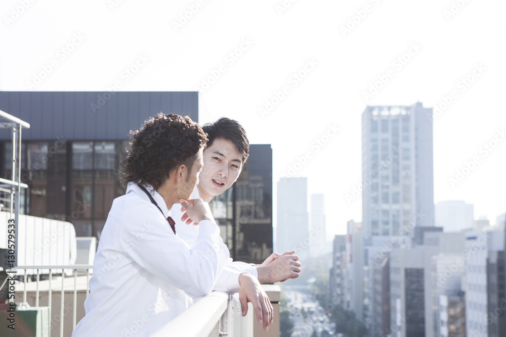 Doctors are consulting colleagues on the rooftop