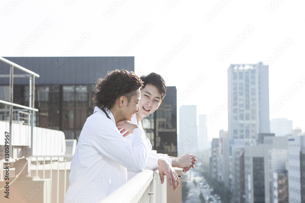 Doctors are consulting colleagues on the rooftop