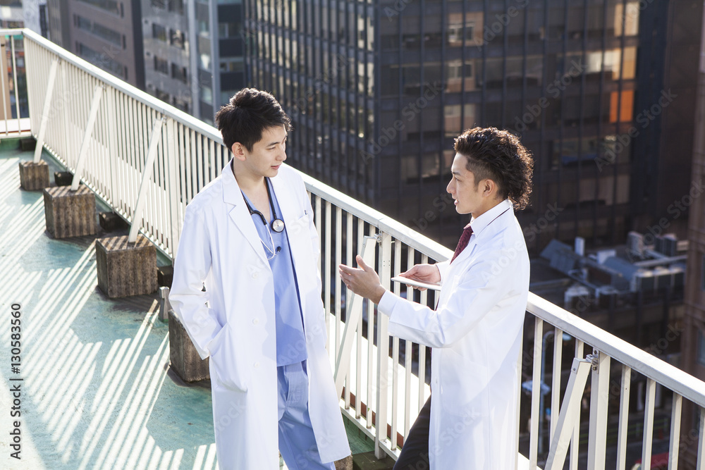 Doctors talking on the hospitals rooftop