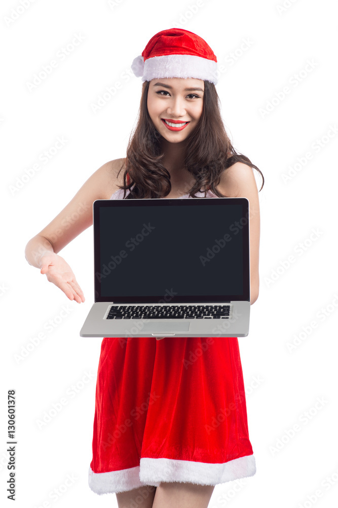 Asian Christmas girl with Santa Claus clothes holding laptop iso