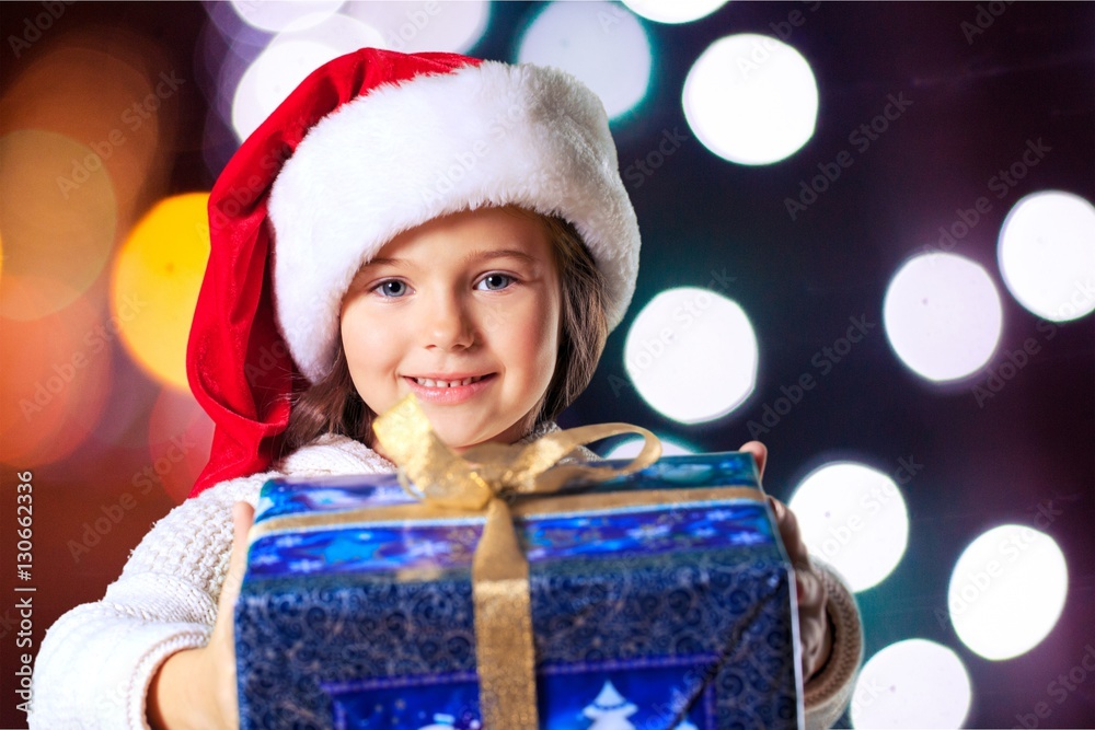 Child giving a christmas present.