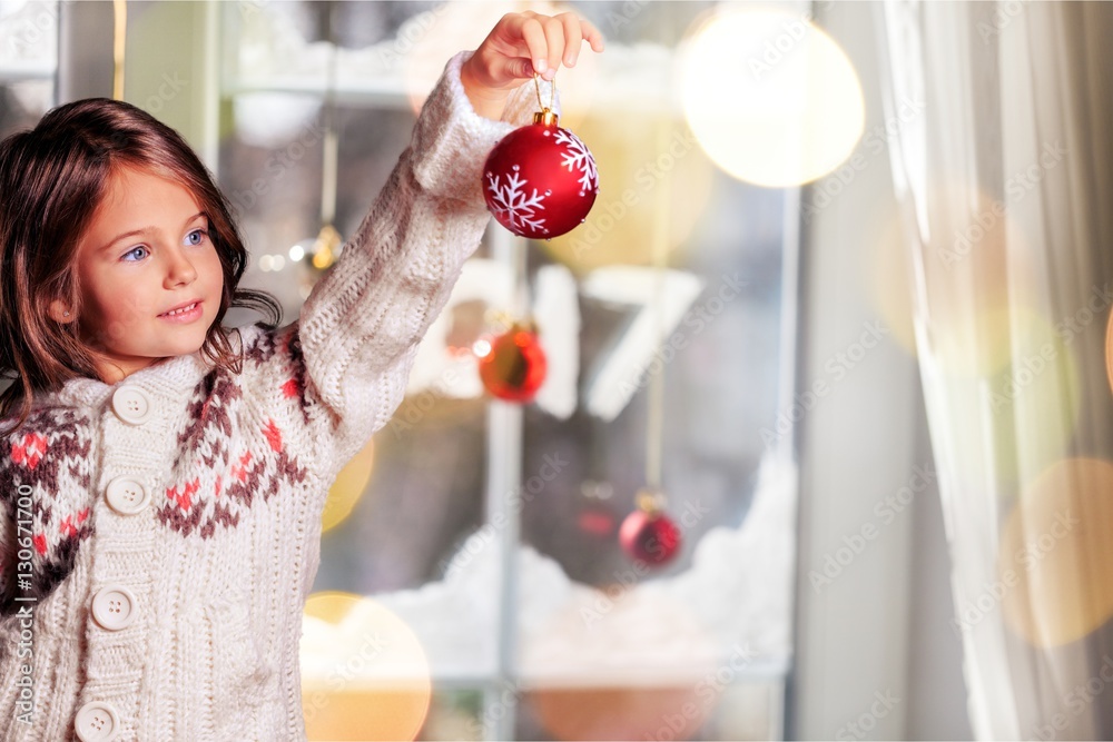 Little girl decorating.