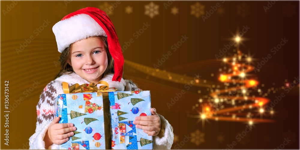 Child giving a christmas present.