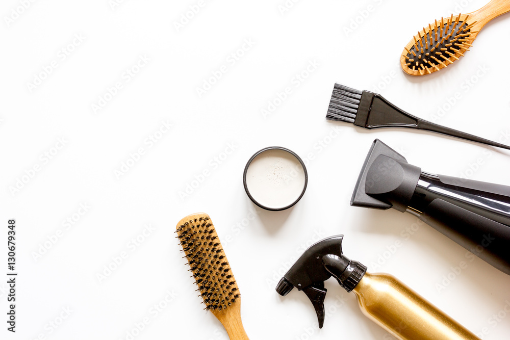 combs and hairdresser tools on white background top view