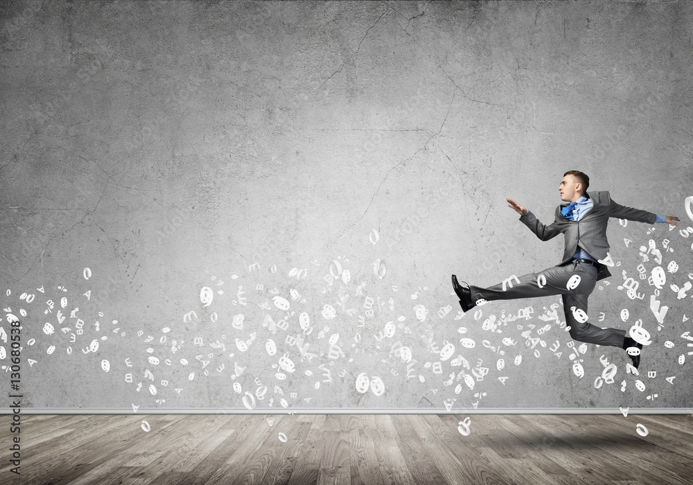 Businessman jumping high