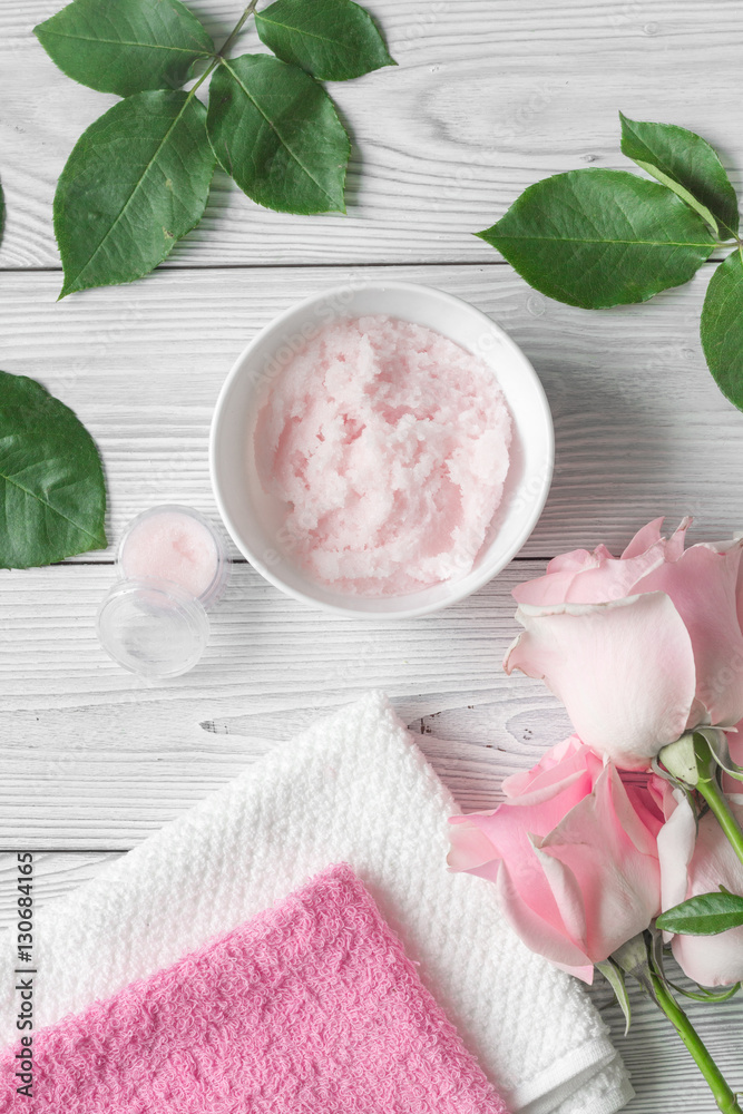 organic cosmetic with rose oil on wooden background top view