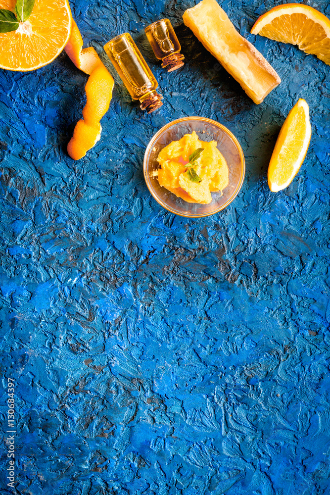 organic cosmetic with citrus on blue background top view