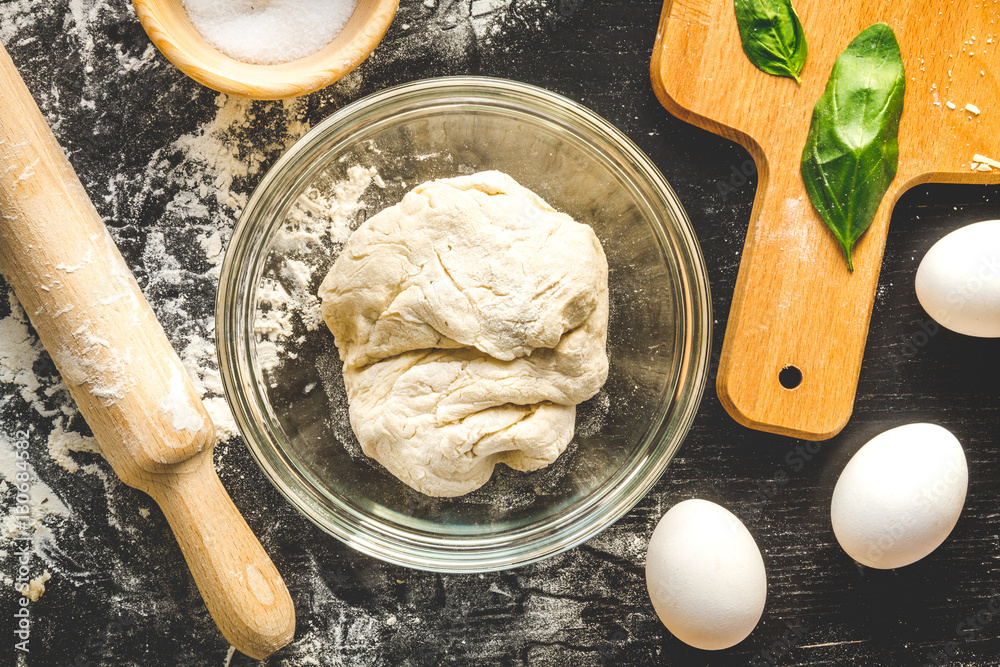 cooking process of pasta on dark background top view