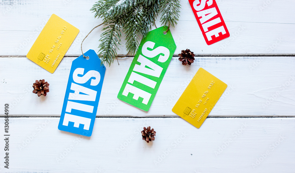 winter clothing sale on wooden background top view