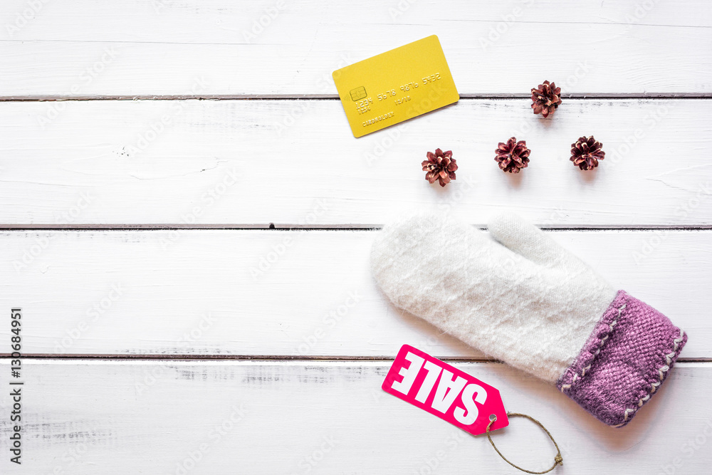 Christmas clothing sale on wooden background top view