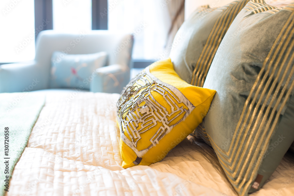 pillows on comfortable bed in modern bedroom