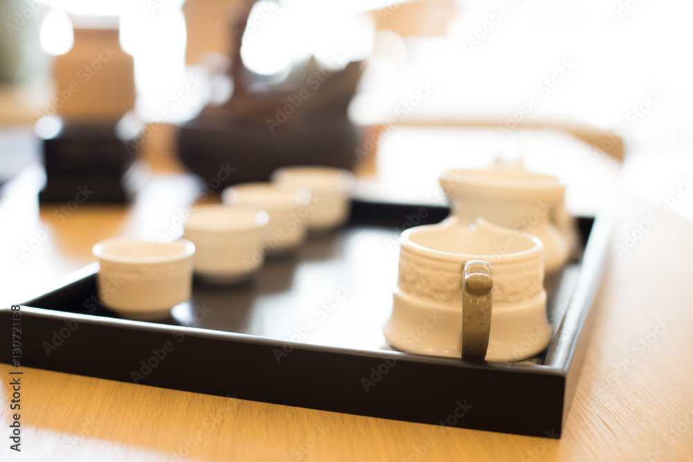 elegant ceramic tea sets on table in modern living room