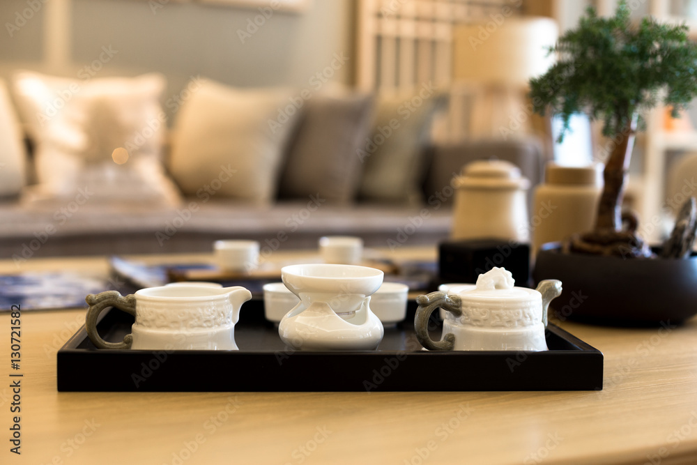 elegant ceramic tea sets on table in modern living room