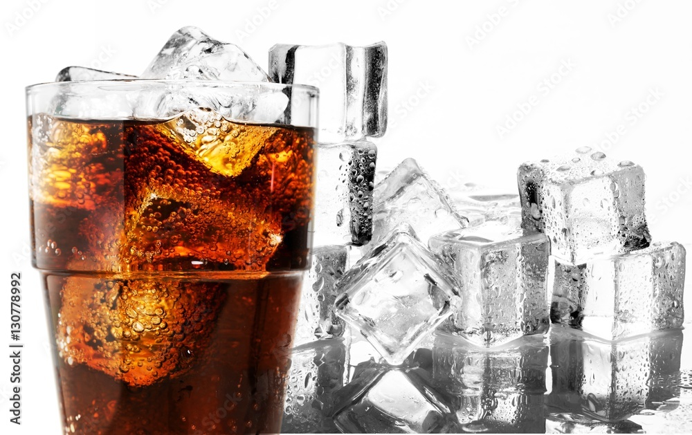 Cola soda drink in glass with ice cubes on white background