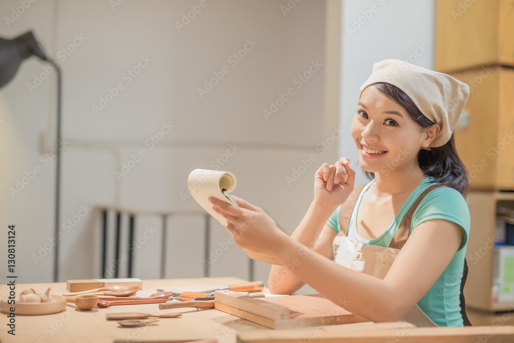 woman woodworking smile happily