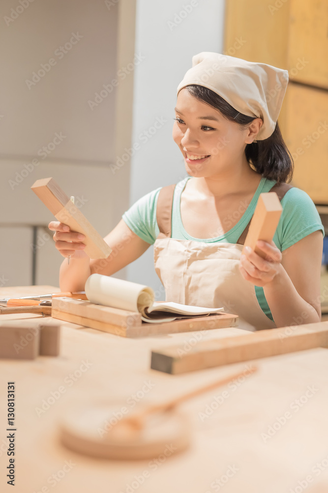 woman woodworking smile happily