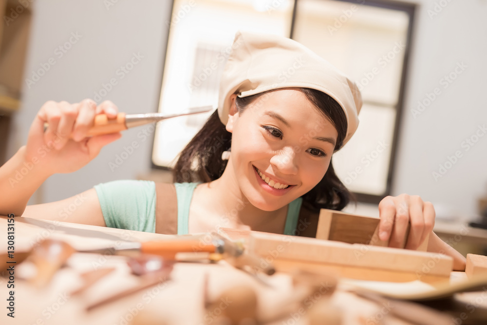 woman woodworking smile happily