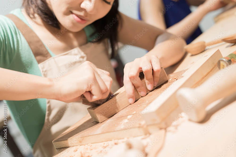 woman woodworking smile happily